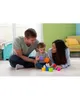 A family playing with stacking cups on the floor. Produktbild-Vorschau