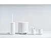 A set of white bathroom accessories arranged on a white surface against a white background. Produktbild-Vorschau