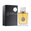 A perfume bottle and its box are displayed against a white background. Voir les images du produit