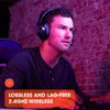 A man wearing headphones and playing a video game. Produktbild-Vorschau