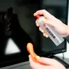 A person is cleaning a TV screen with a spray bottle and a cleaning cloth. Náhled obrázku produktu