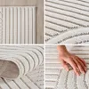 A collage of four close-up images showcasing the texture and design of a rug. Voir les images du produit