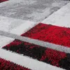 A close-up view of a rug with a geometric pattern. Produktbild-Vorschau