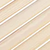 A close-up, diagonal view of light-colored wooden slats with white gaps between them. Náhled obrázku produktu