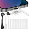 A close-up of a smartphone charging port being cleaned with a brush, with various cleaning tools laid out below. Voir les images du produit