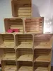 A stack of wooden crates arranged in a shelving unit. Produktbild-Vorschau