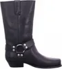 A black leather boot with a silver buckle and strap. Voir les images du produit