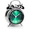 A close-up studio shot of a retro alarm clock with a green face. Voir les images du produit