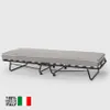 A folding bed with a mattress on a plain background. Anteprima dell’immagine prodotto