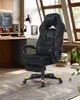 A black and yellow gaming chair is positioned on a patterned rug in a room with natural light from a window. Náhled obrázku produktu