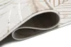 A close-up view of a rolled-up rug, showing the texture and edge binding. Produktbild-Vorschau