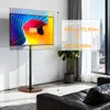 A TV stand with a TV on it in a modern living room with a sofa and a plant. Anteprima dell’immagine prodotto