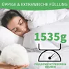 A woman sleeping under a white duvet, with a pile of down filling and a scale icon indicating weight. Produktbild-Vorschau