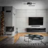 A modern living room with a fireplace, TV, and coffee table. Produktbild-Vorschau