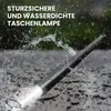 A black flashlight is shown being sprayed with water, with text overlay indicating it is drop-proof and waterproof. Produktbild-Vorschau