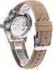 Close-up view of the back of a watch with a brown suede strap. Voir les images du produit