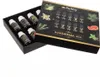 A box of essential oils with the lid open, showing the bottles inside and the product details on the lid. Produktbild-Vorschau