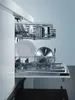 The inside of a dishwasher with dishes and pots loaded. Anteprima dell’immagine prodotto