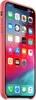 A pink iPhone Xs Max with its screen displaying various app icons. Podgląd zdjęcia produktu