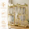 A multi-level clothing rack made of natural bamboo, filled with white and off-white clothes. Produktbild-Vorschau