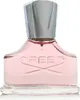 A close-up studio shot of a pink Creed perfume bottle with a silver cap. Anteprima dell’immagine prodotto