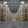 A long, wide view down an aisle in a warehouse, with tall shelves filled with boxes on either side. The floor is reflective and shows the reflection of the shelves and ceiling lights. Podgląd zdjęcia produktu