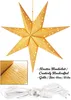 A golden star-shaped paper lantern with small star cutouts, hanging from a string. A close-up of the lantern's texture is shown in the bottom left corner, along with a white power cord and plug. Text describes the product's features and size. Voir les images du produit
