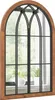 A mirror with a window-like design, featuring a wooden frame and black metal mullions, reflecting a window with plants on a windowsill. Náhľad obrázku produktu