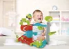 A baby is playing with a colorful toy garage in a nursery. Podgląd zdjęcia produktu