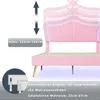 A pink upholstered bed frame with a crown-shaped headboard, showing adjustable height and mattress thickness. Produktbild-Vorschau