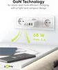 A white GaN charger plugged into a wall socket, charging two devices. Podgląd zdjęcia produktu