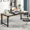 A modern office desk setup with a computer, lamp, and books. Anteprima dell’immagine prodotto
