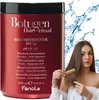 A woman is shown with a large red hair mask container and is combing her hair. Anteprima dell’immagine prodotto