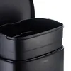 Close-up view of the top section of a black trash can, showing the inner bin and part of the lid. Produktbild-Vorschau