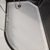 The image shows the interior of a shower tray with a textured surface and a drain. Náhled obrázku produktu