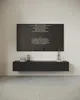 A modern living room with a wall-mounted TV displaying credits, a black wooden TV stand, and decorative items. Produktbild-Vorschau