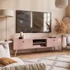 A modern living room with a pink TV stand and a large television. Produktbild-Vorschau