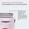 Close-up of a pink and white electric shaver with purple accents, highlighting its shaving head and a descriptive text box. Náhled obrázku produktu