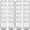 A grid of empty glass jars with white lids. Voir les images du produit