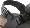 A close-up view of a black Birkenstock sandal strap and buckle. Produktbild-Vorschau