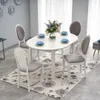A dining table with chairs set up in a room. Náhľad obrázku produktu