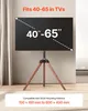 A TV stand with wooden legs is shown with a TV mounted on it. Náhled obrázku produktu