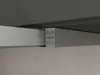 A close-up view of the control panel of a range hood, showing buttons for light and power, as well as plus and minus buttons for adjustment. Produktbild-Vorschau