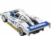 A white and blue toy race car with the Mazda logo and number 18. Voir les images du produit