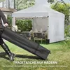 A person is pulling a folded tent in a bag with wheels, with a set-up tent in the background. Produktbild-Vorschau