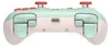 The back view of a mint green and white video game controller. Produktbild-Vorschau