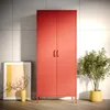 A red wardrobe is placed against a tiled wall, with a framed artwork and a plant in pots nearby. Anteprima dell’immagine prodotto