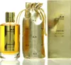 A perfume bottle, a drawstring pouch, and a box for Mancera Gold Intensitive Aoud Eau de Parfum. Podgląd zdjęcia produktu