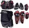 A collection of hockey protective gear laid out on a white background. Podgląd zdjęcia produktu