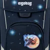 A close-up view of a dark blue backpack with a space-themed pattern, featuring a spaceship patch. Produktbild-Vorschau